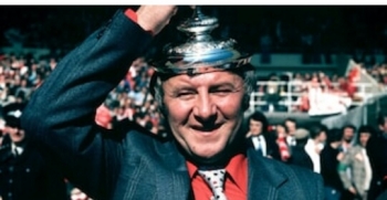 Manchester United manager Tommy Docherty in high spirits following his sides victory in the FA Cup in 1977.