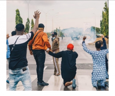 Davido goes down on his knees to beg for the release of 20 protester
